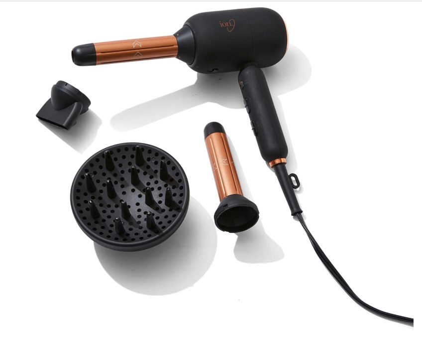 Professional hair styling tools including flat iron and curling wand